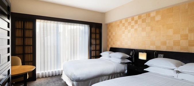 A room with two bedsAI-generated content may be incorrect.