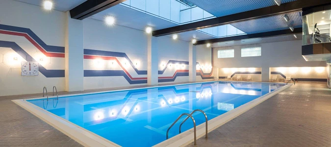 A swimming pool in a buildingAI-generated content may be incorrect.